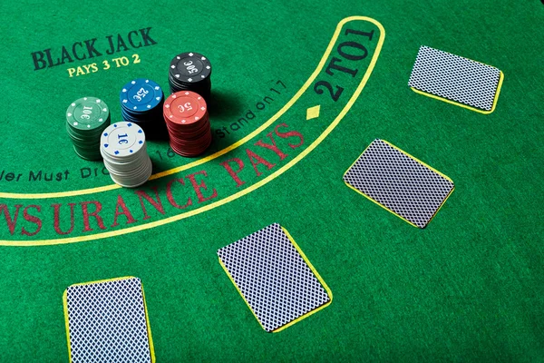 Casino chips and cards on casino table, poker game concept