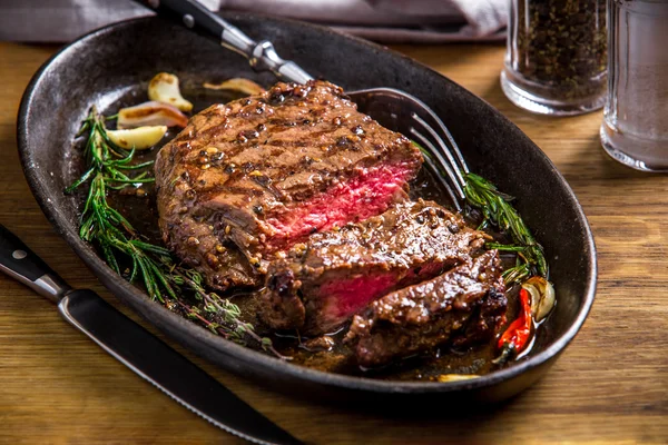 Healthy lean grilled medium-rare steak and vegetables