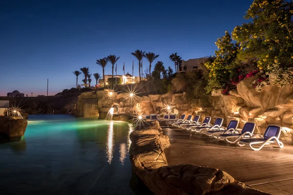 Long exposure shot of swimming pool at luxury night illumination