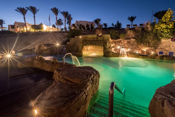 Long exposure shot of swimming pool at luxury night illumination