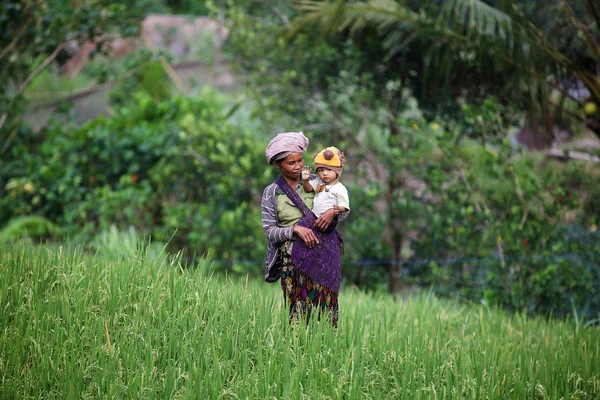 Balinese woman with child