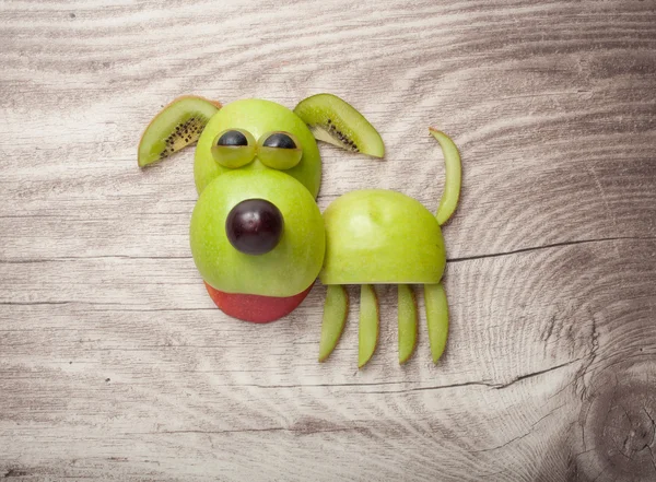 Dog made of apple, kiwi and grape