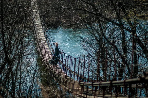 Girl on the bridge over the river