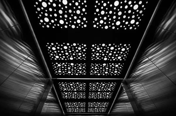 Elevator cabin. Starry reflection of the lights on the ceiling of the cabin