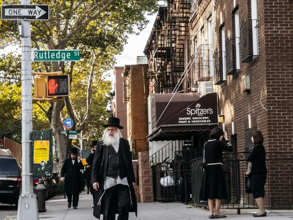 Jewish hassidic man crosses the street.