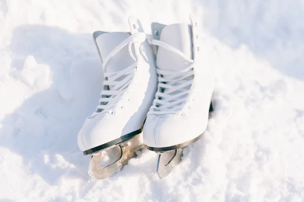 Figure skates in snow close-up
