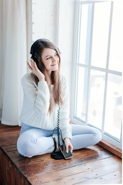 Woman listening music with headphones. relax and unwind