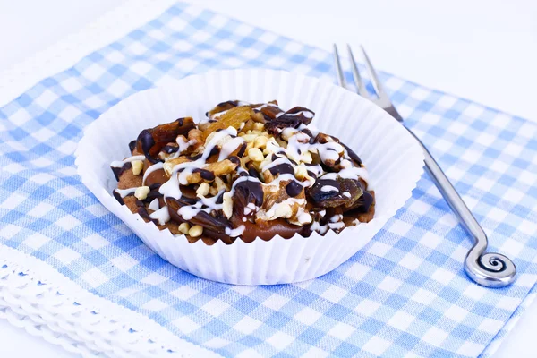 Homemade Cakes: Cake on Plate with Nuts, Chocolate and Raisins