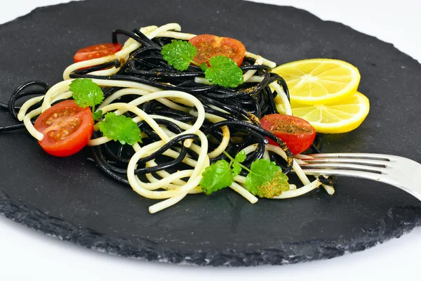 Black Spaghetti with Cuttlefish Ink, Tomato and Basil. Mediterra