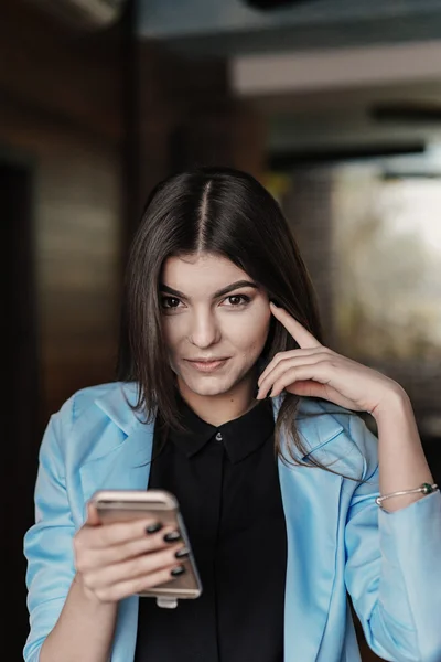 Beautiful girl works with technologise on the phone