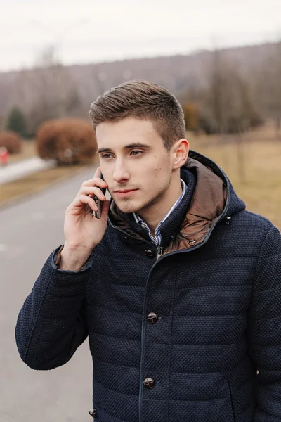 Beautiful business guy with phone