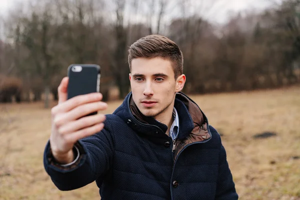 Beautiful business guy with phone