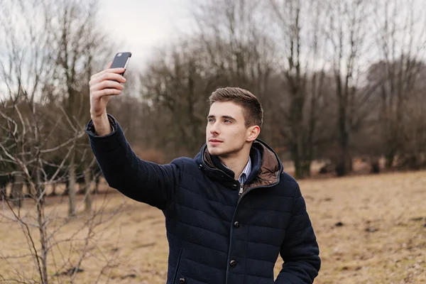 Beautiful business guy with phone