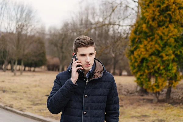 Beautiful business guy with phone