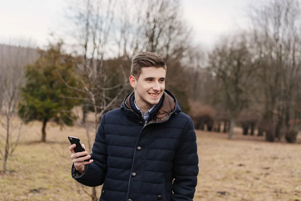 Beautiful business guy with phone