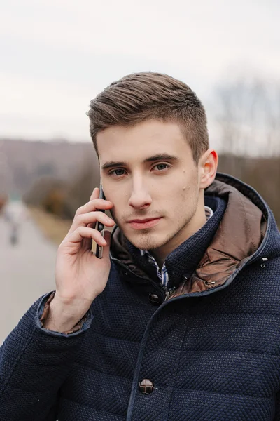 Beautiful business guy with phone