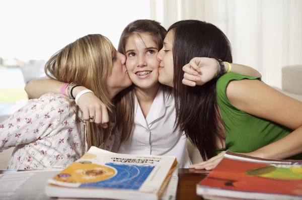 Student girls kissing friend