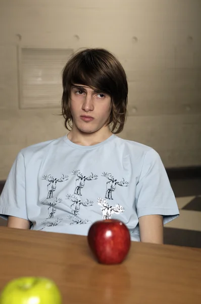 Bored student sitting in cafeteria