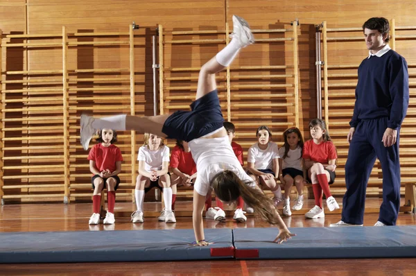 Group of children doing gymnastics