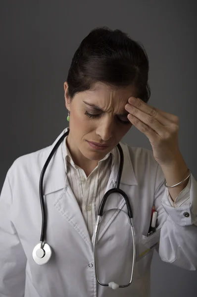 Female doctor with headache