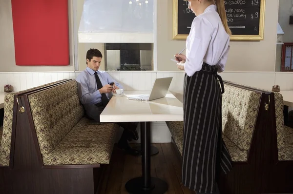 Waitress writing order