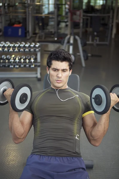 Man exercising with dumbbells