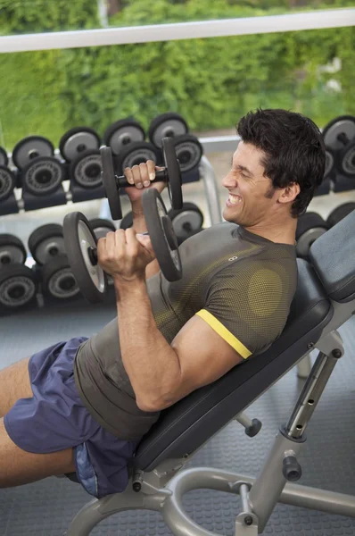 Man exercising with dumbbells