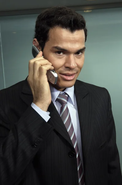 Businessman using his cellular phone