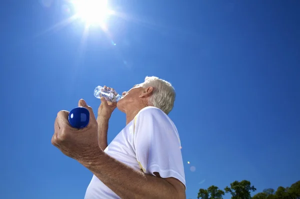 An elderly man exercising