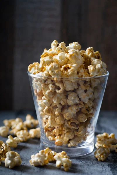 Popcorn with caramel in glass bowl