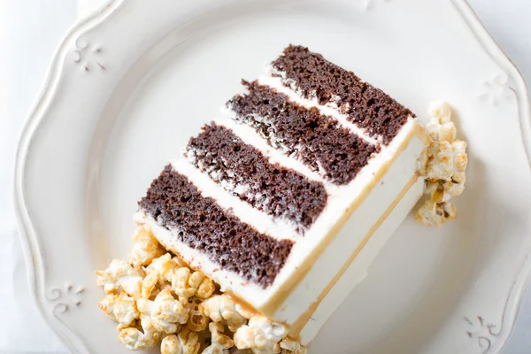 Chocolate cake with caramel and popcorn
