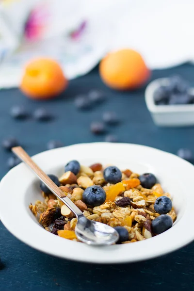 Homemade granola with blueberries and dried apricots