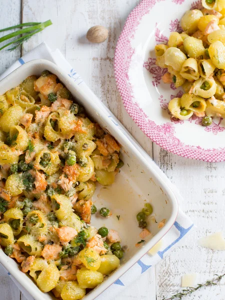 Pasta casserole with salmon and peas