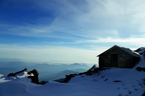 House in mountains at sunrise