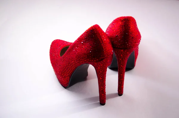 Close up of a red high heels on white background