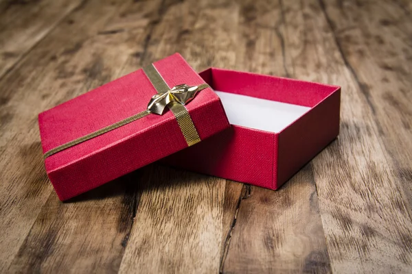 Gift box on wooden table