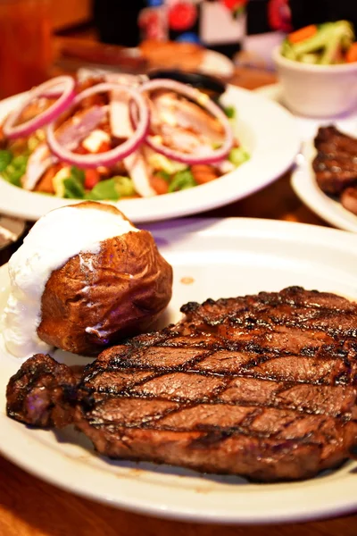 Rib eye steak with ribs and mash potato at the restaurant
