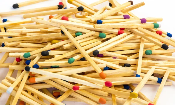 Multicolored matches on white background