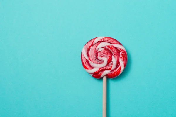 Lollipops candy on blue background. Funny concept. Image with copy space.