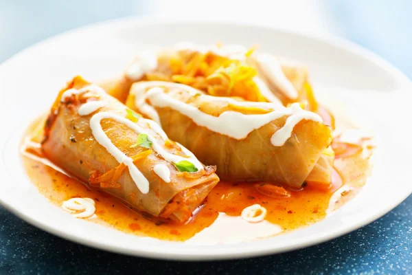 Cabbage rolls with meat, carrots and rice, closeup.