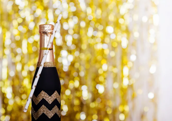 Mini Sparkling Wine Bottle Wedding Favors  on bright sparkling blurred background