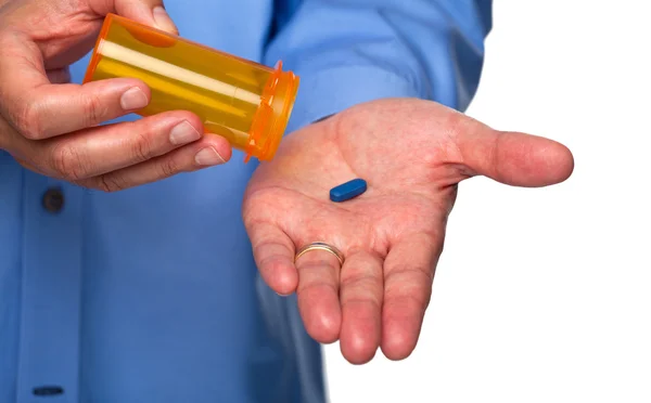 Man holds one pill left