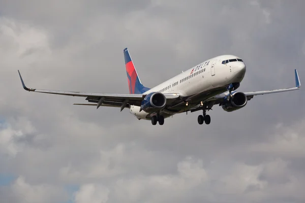FORT LAUDERDALE, USA - November 4, 2015: A Delta Air Lines Boeing 737 aircraft landing at the Fort Lauderdale/Hollywood International Airport.