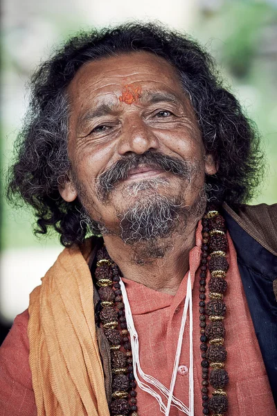 Smiling Indian Brahmin. Indian man poses for photo.