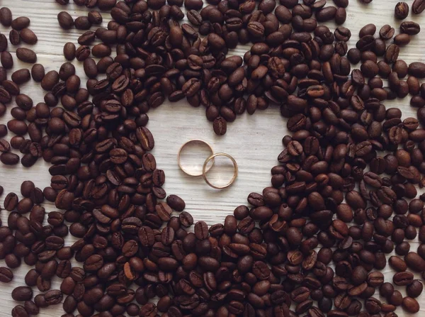 Wedding rings and coffee beans