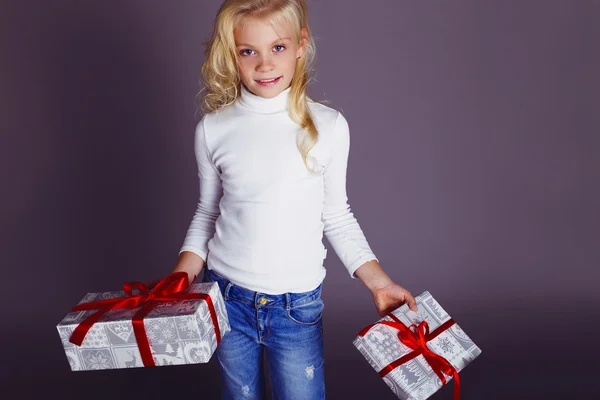 Little santa girl with Christmas presents