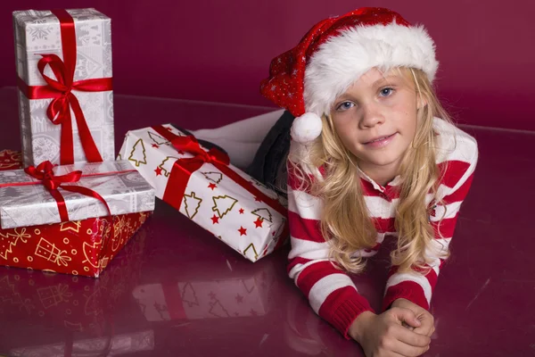 Little santa girl with Christmas gifts