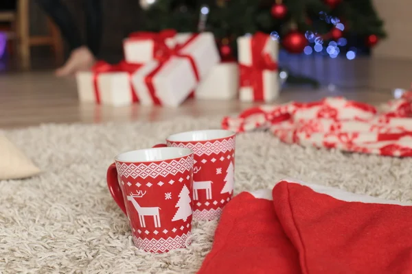 Christmas hats, cups and gift boxes