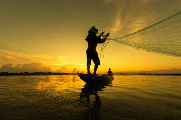 Fishermen silhouette lifestyle in action when fishing in the river