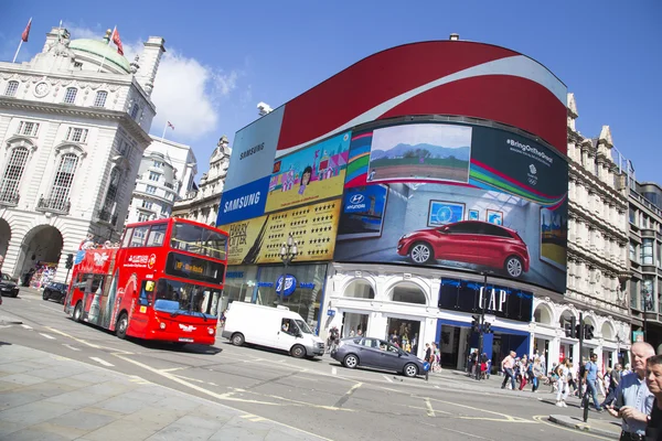 Site seeing bus passes large screen in piccadilly circus